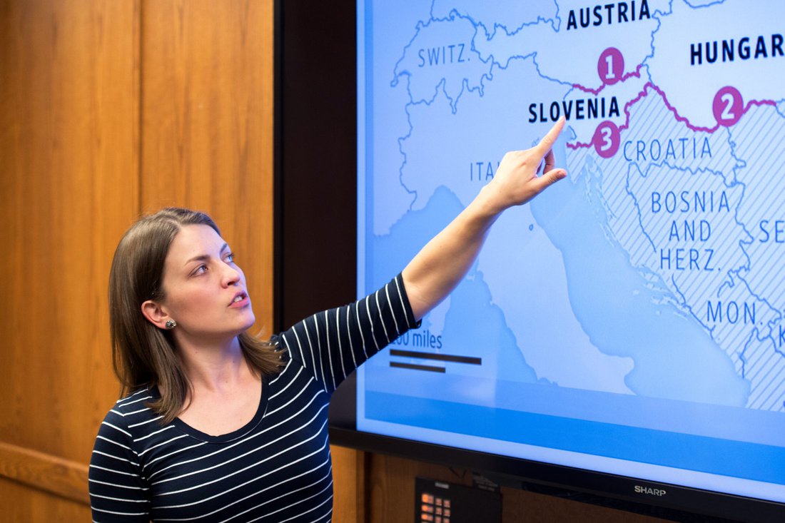 A social science student point to Slovenia on a map of Europe during a presentation