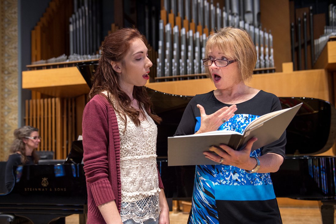 Performance student works with professor on singing voice